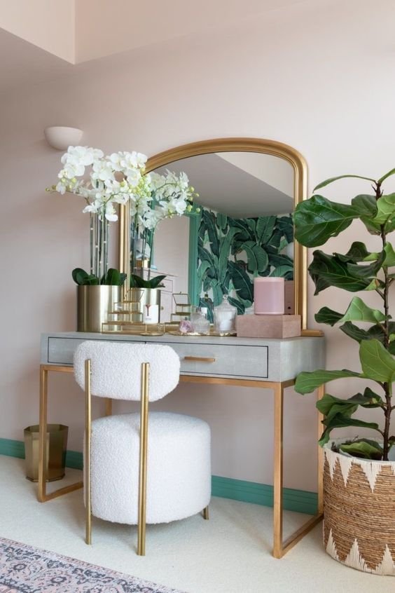 Gold tiered tray for displaying perfumes and decor