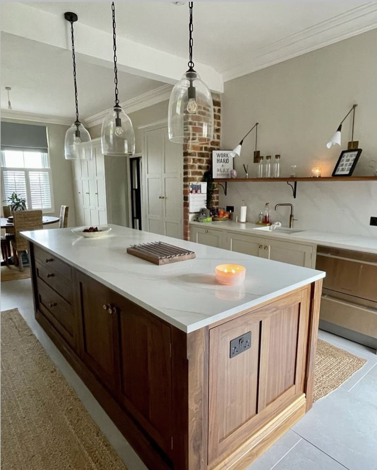 Paneled Walnut Island Hides Outlets for a Streamlined Look