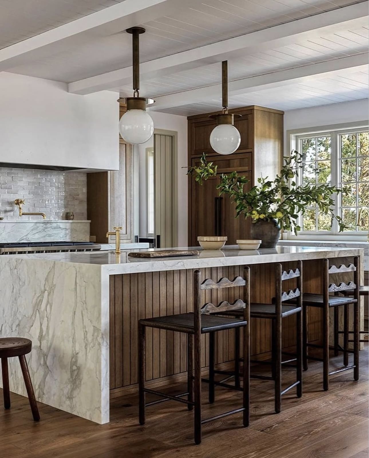 Vertical Wood Paneling on Island Base Adds Natural Texture