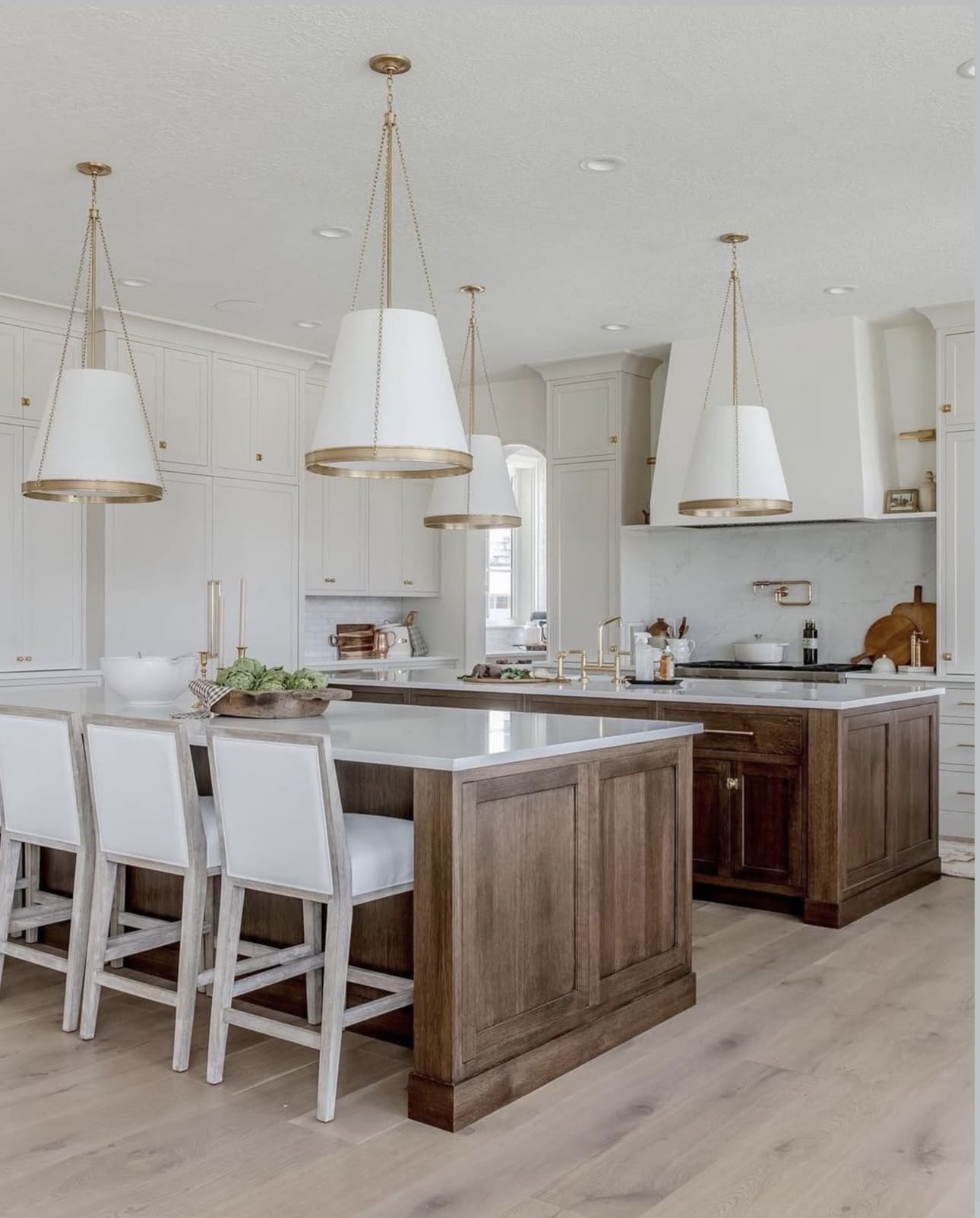 Warm Walnut Islands Anchor This Bright, Modern Kitchen