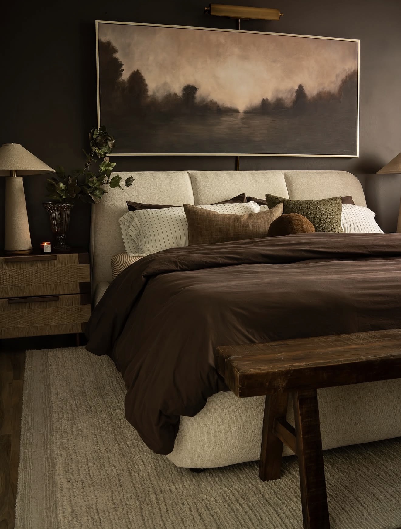 Large Landscape Art Sets a Moody, Muted Tone Above the Bed