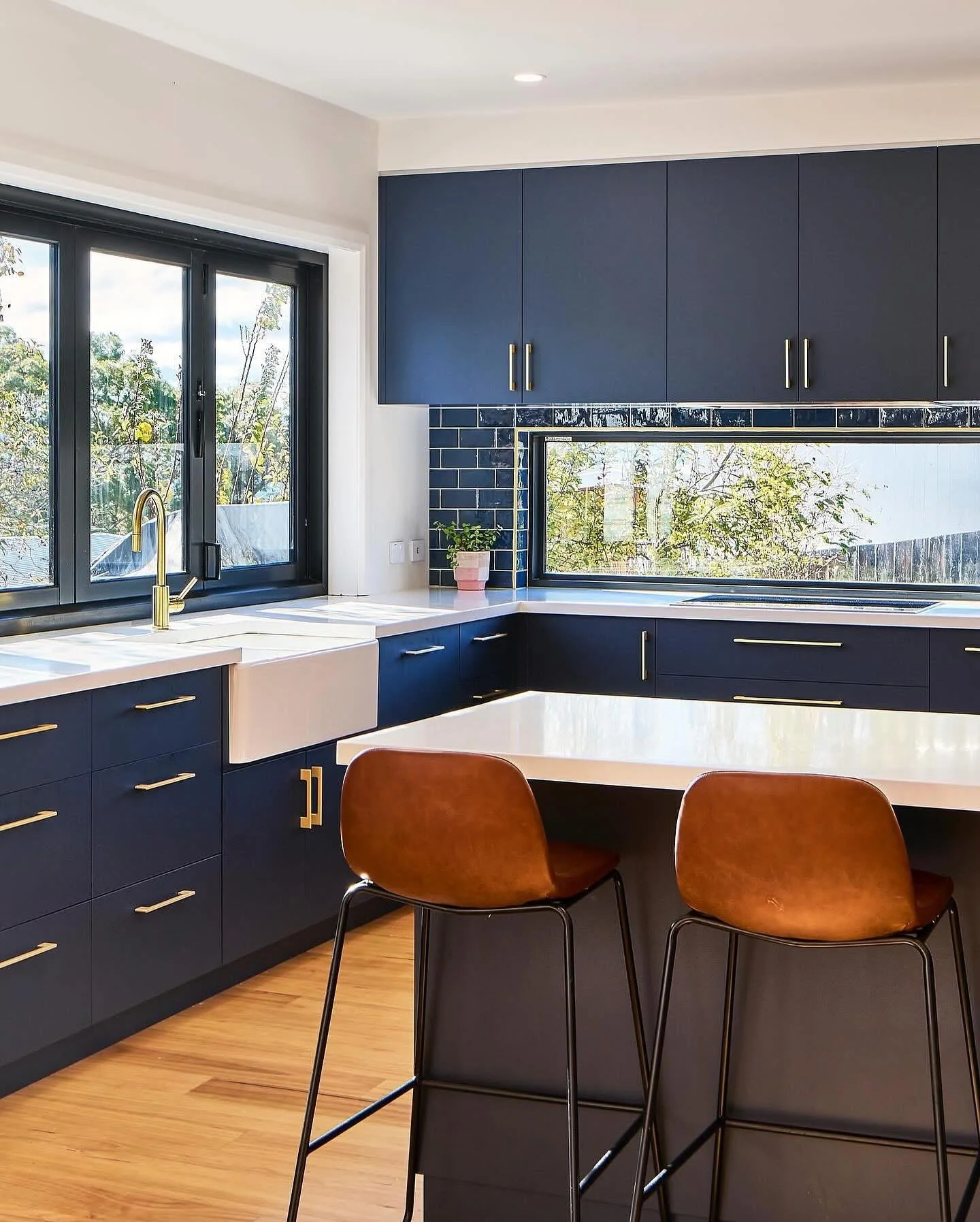 Subtle Navy Subway Tile Backsplash Enhances Cabinetry