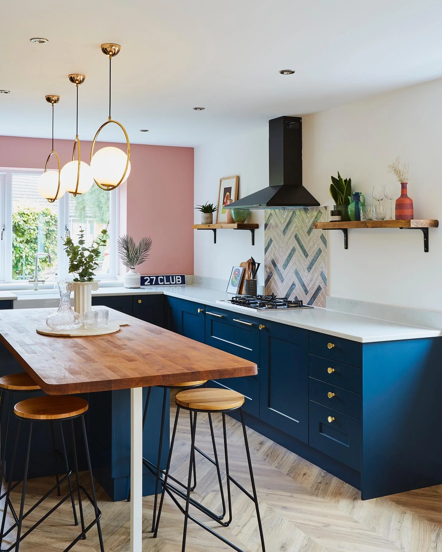 Brass Ring Pendants Add Warm Glow Above Navy Island