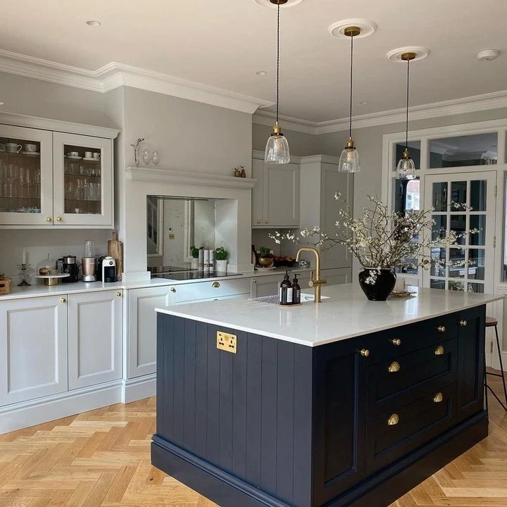 Showcase Paneled Drawers and Brass Hardware on Your Navy Island