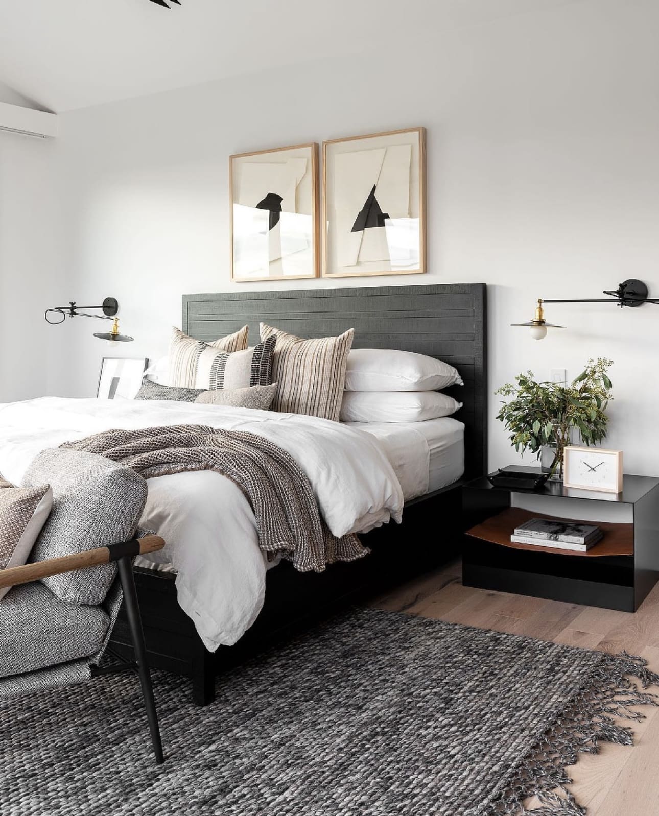 Abstract Art Prints Frame a Dark Wood Headboard