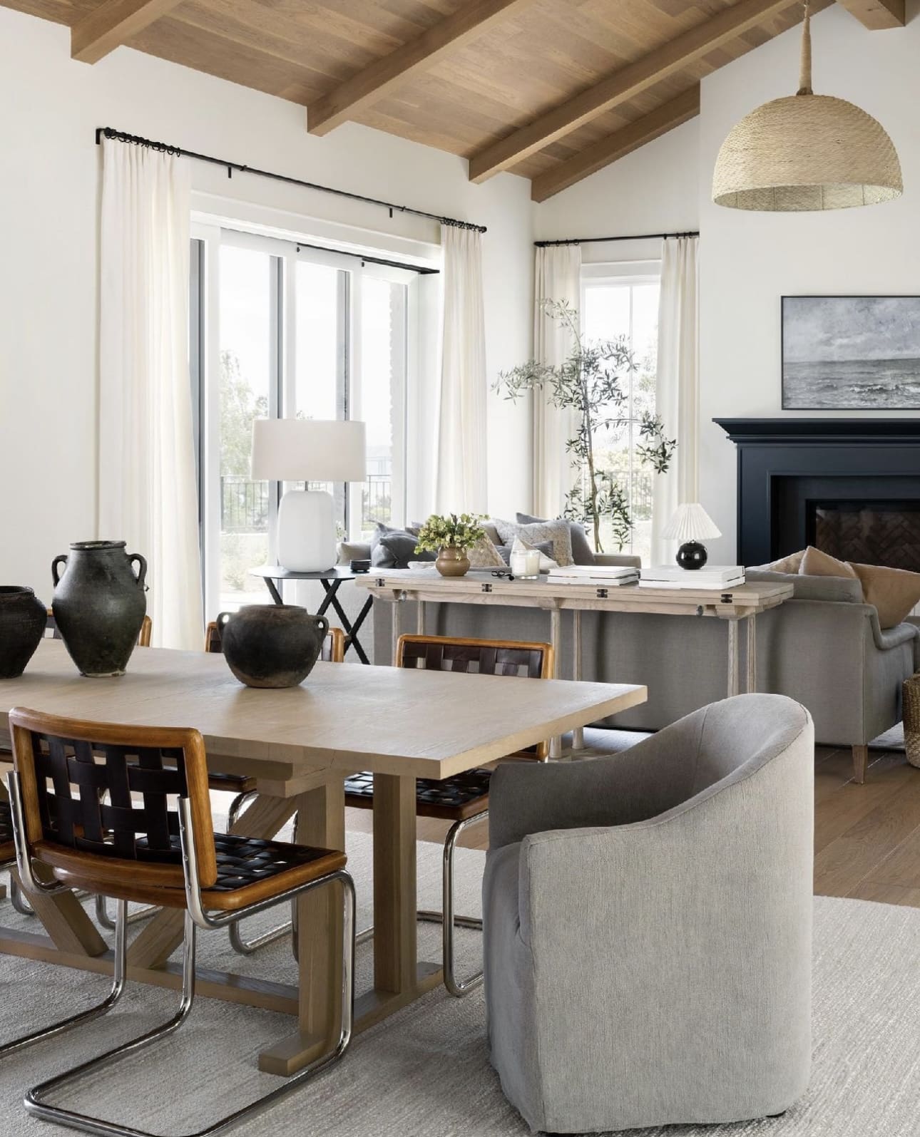 Large Matte Black Vases Add Sculptural Interest to Dining Table