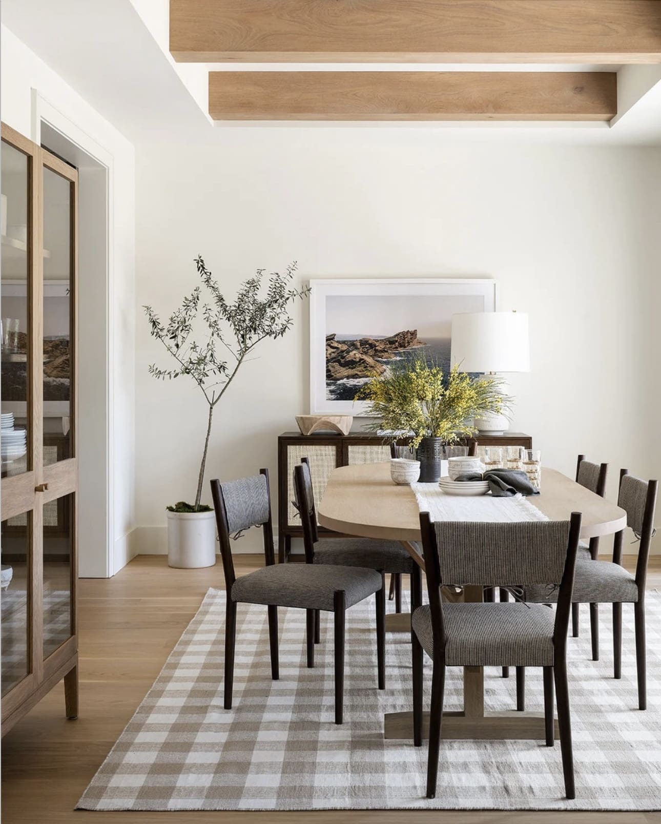 Tall Potted Tree Adds Organic Height Next to Dining Room Cabinet