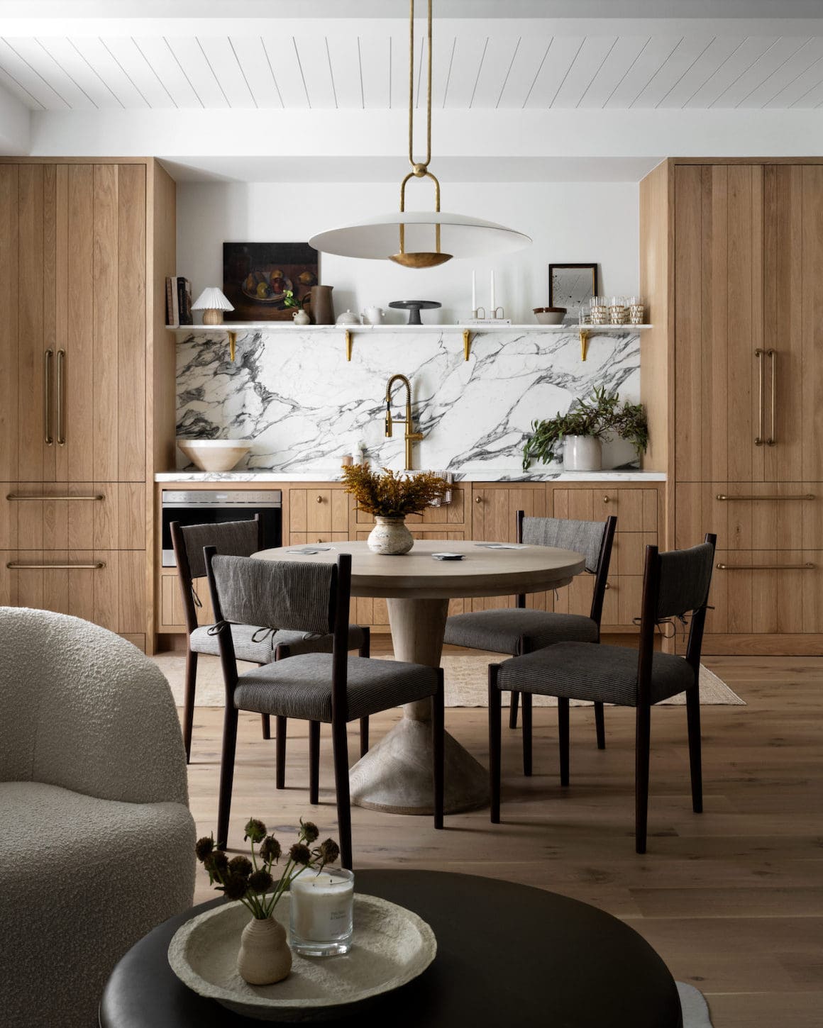 Round Pedestal Table With Tapered Base Grounds the Dining Area