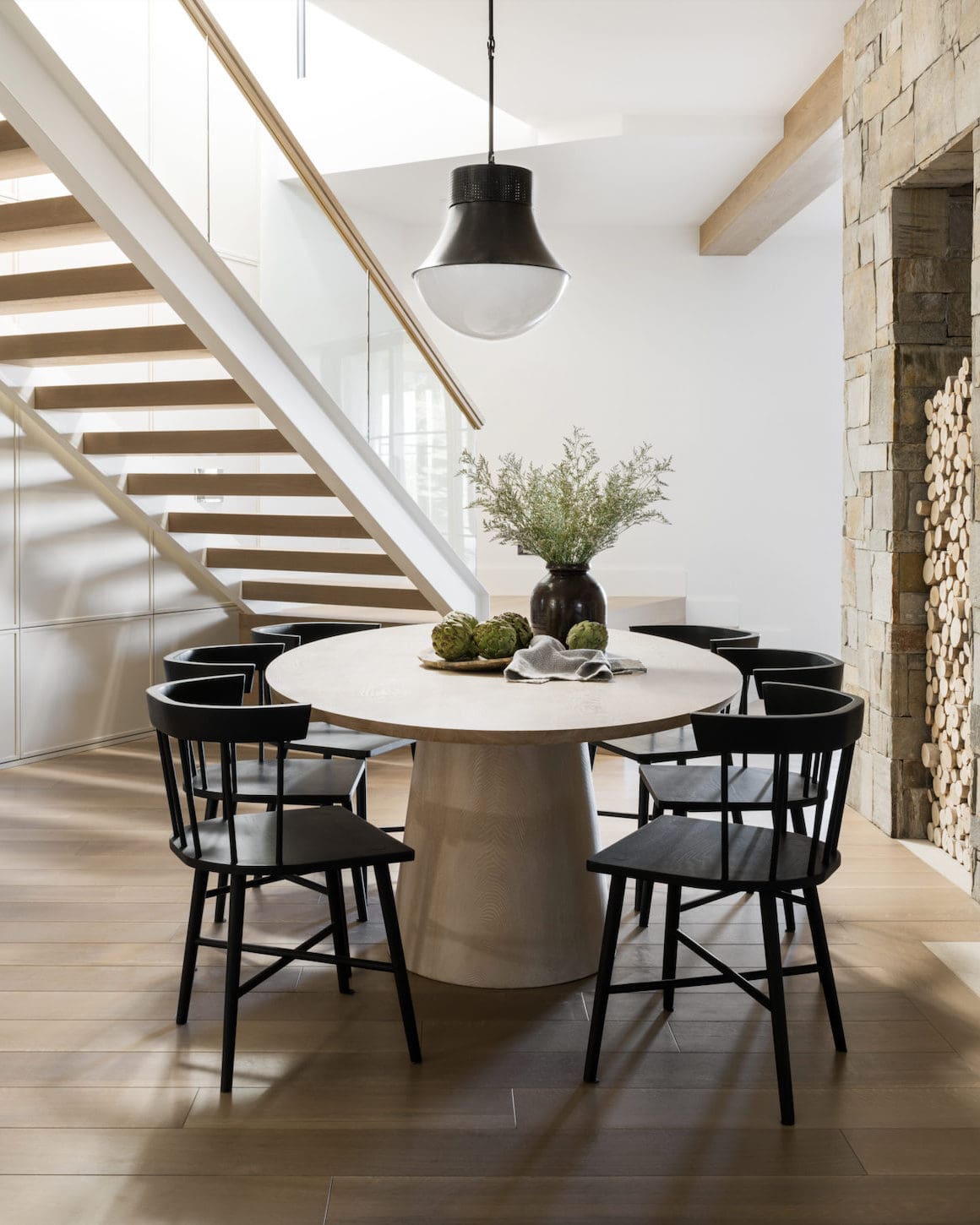 Textured Pedestal Base Grounds the Oval Dining Table