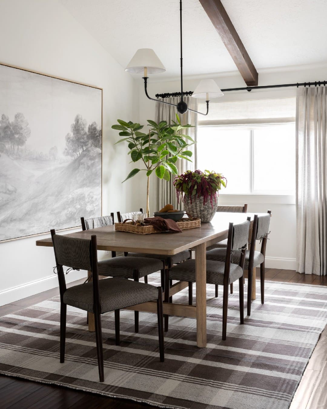 Graphic Plaid Rug Anchors the Dining Room Layout