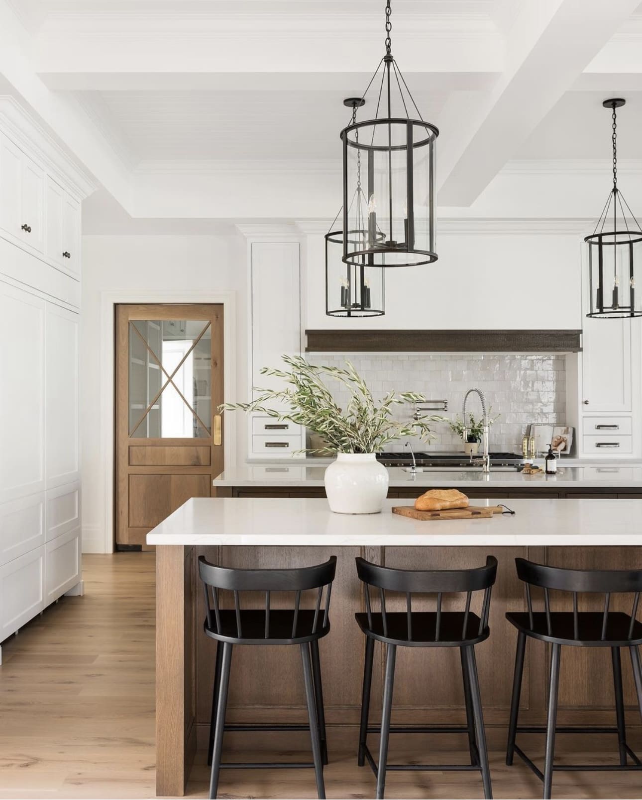 Cylindrical Glass Lanterns Add Classic Style Over Island