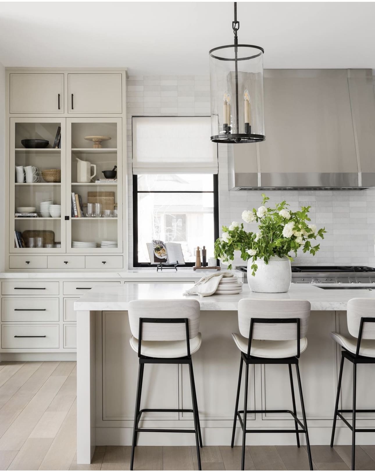 Glass-Enclosed Cabinetry Displays Everyday Dishes and Decor