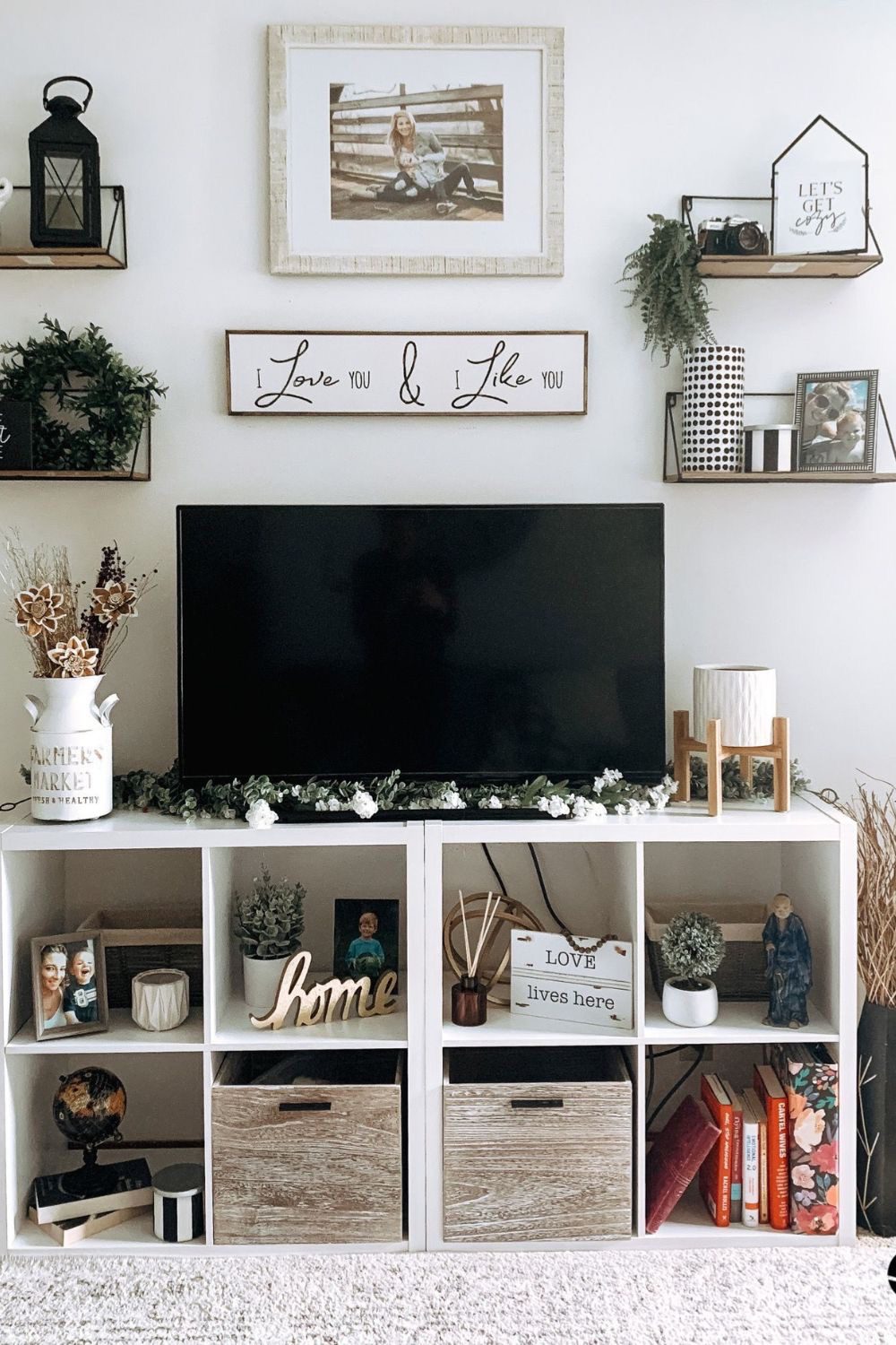 Layered Greenery Frames the TV for a Fresh Look