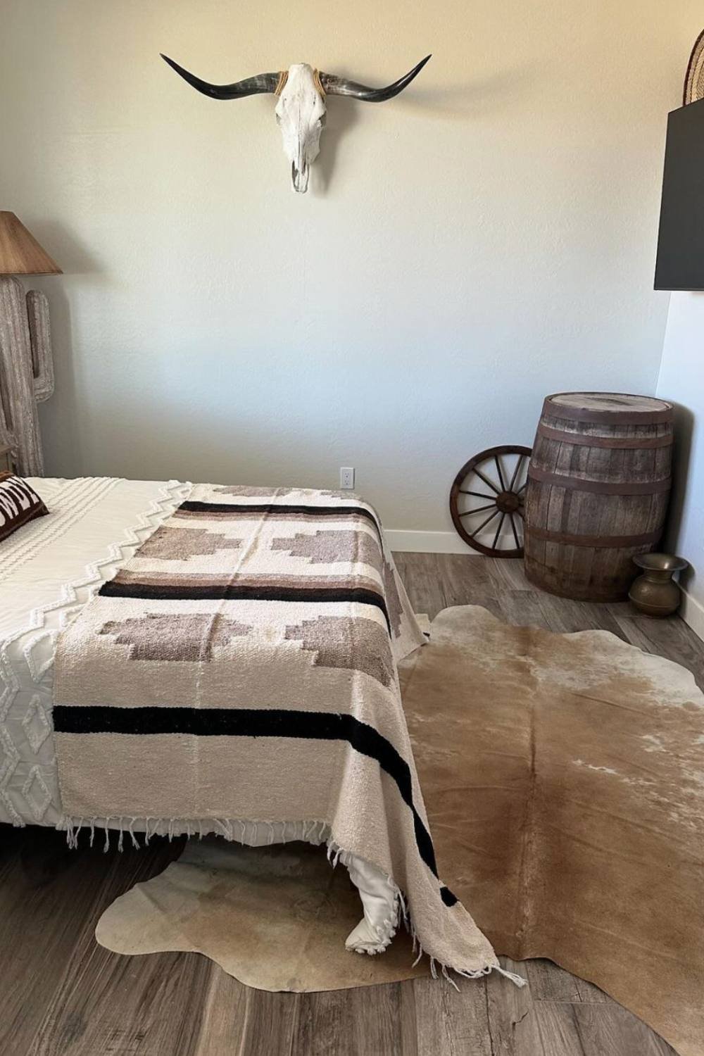 Wooden Barrel Adds Rustic Charm Next to Bed