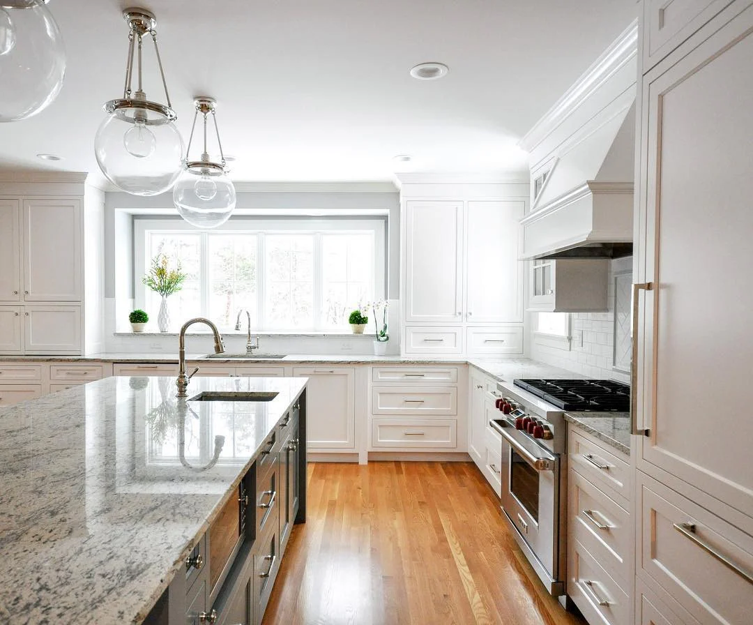 Clear Globe Pendants Add Airy Elegance Above Island