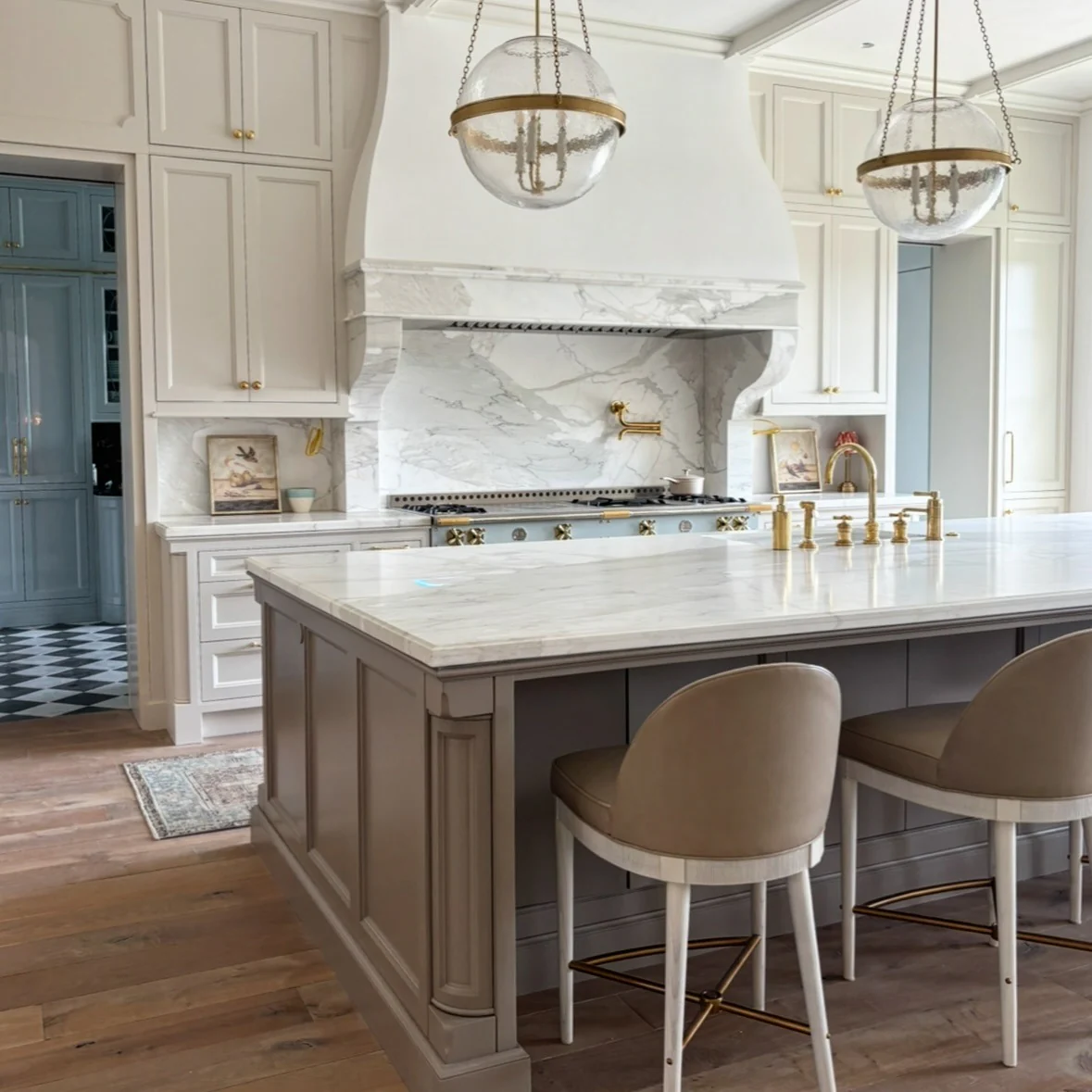 Marble Slab Backsplash with Integrated Brass Faucet