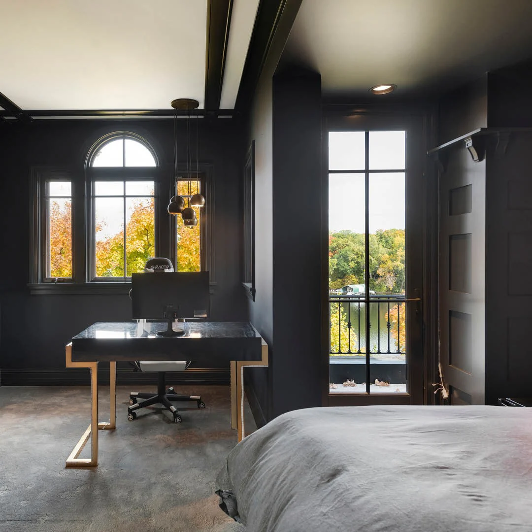 Dark Walls and Gold Desk Create a Moody Office Corner