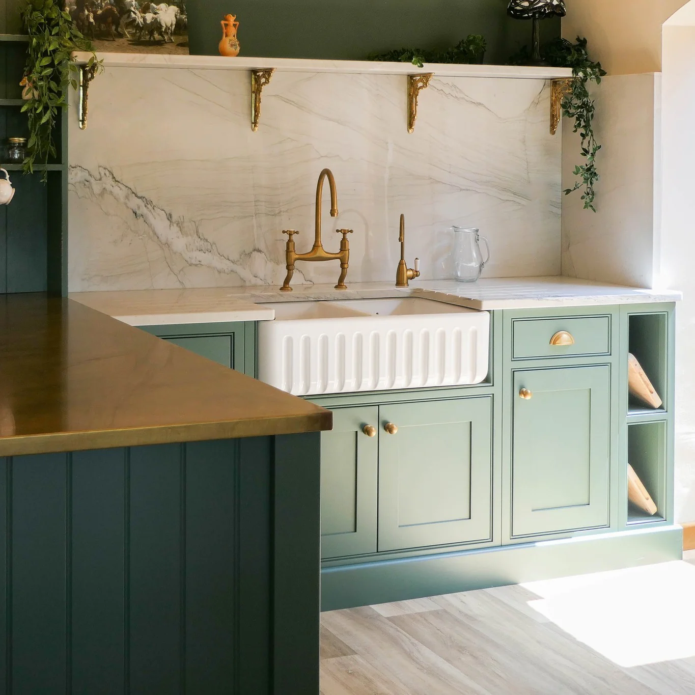 Marble Backsplash and Brass Faucet Create a Luxe Sink Zone