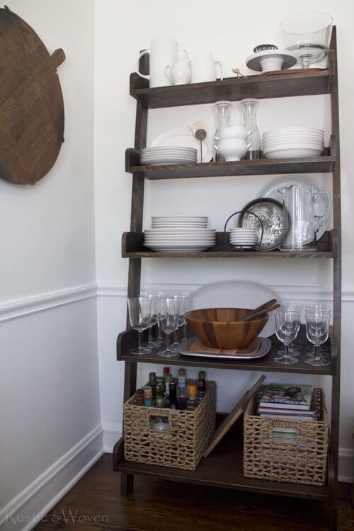 Corral Bottles and Books in Woven Baskets on a Ladder Shelf