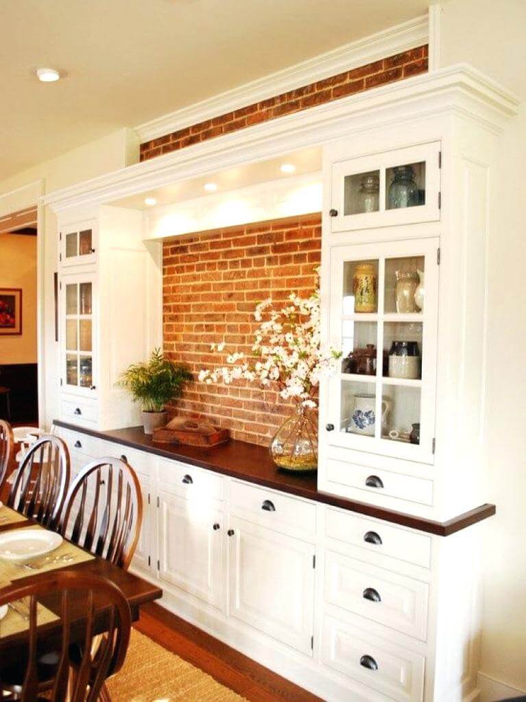 White Built-In Cabinets and Drawers Create a Seamless Dining Room Storage Wall