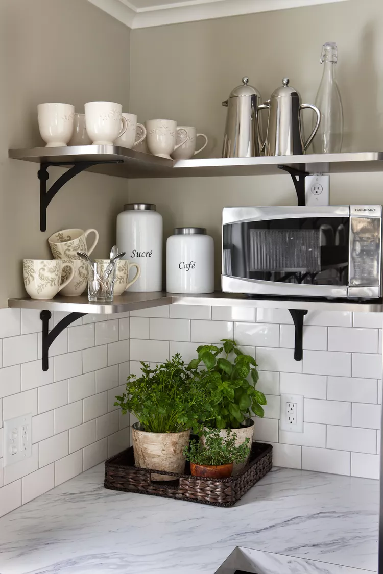Group Potted Herbs in Textured Planters on a Woven Tray
