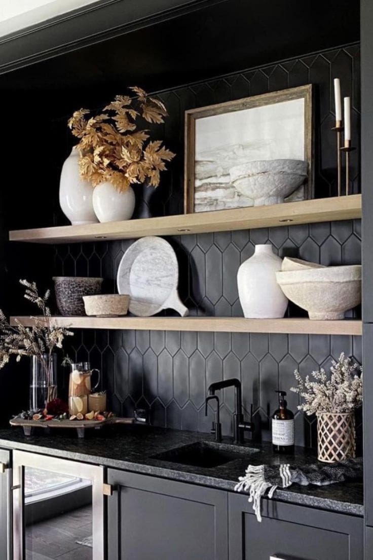 Two White Vases Hold Golden Leafy Branches