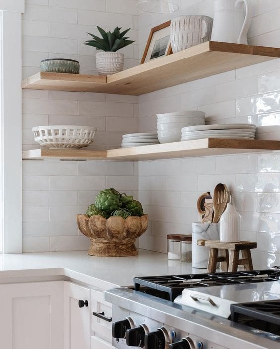 Carved Wooden Bowl Holds Artichokes for Rustic Kitchen Decor