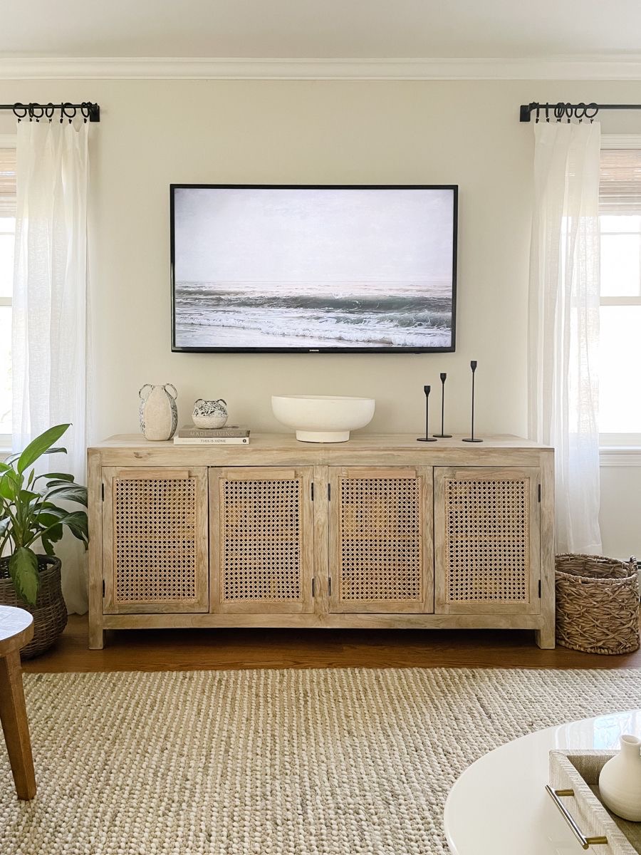 Coastal Artwork Above Cane-Fronted Console