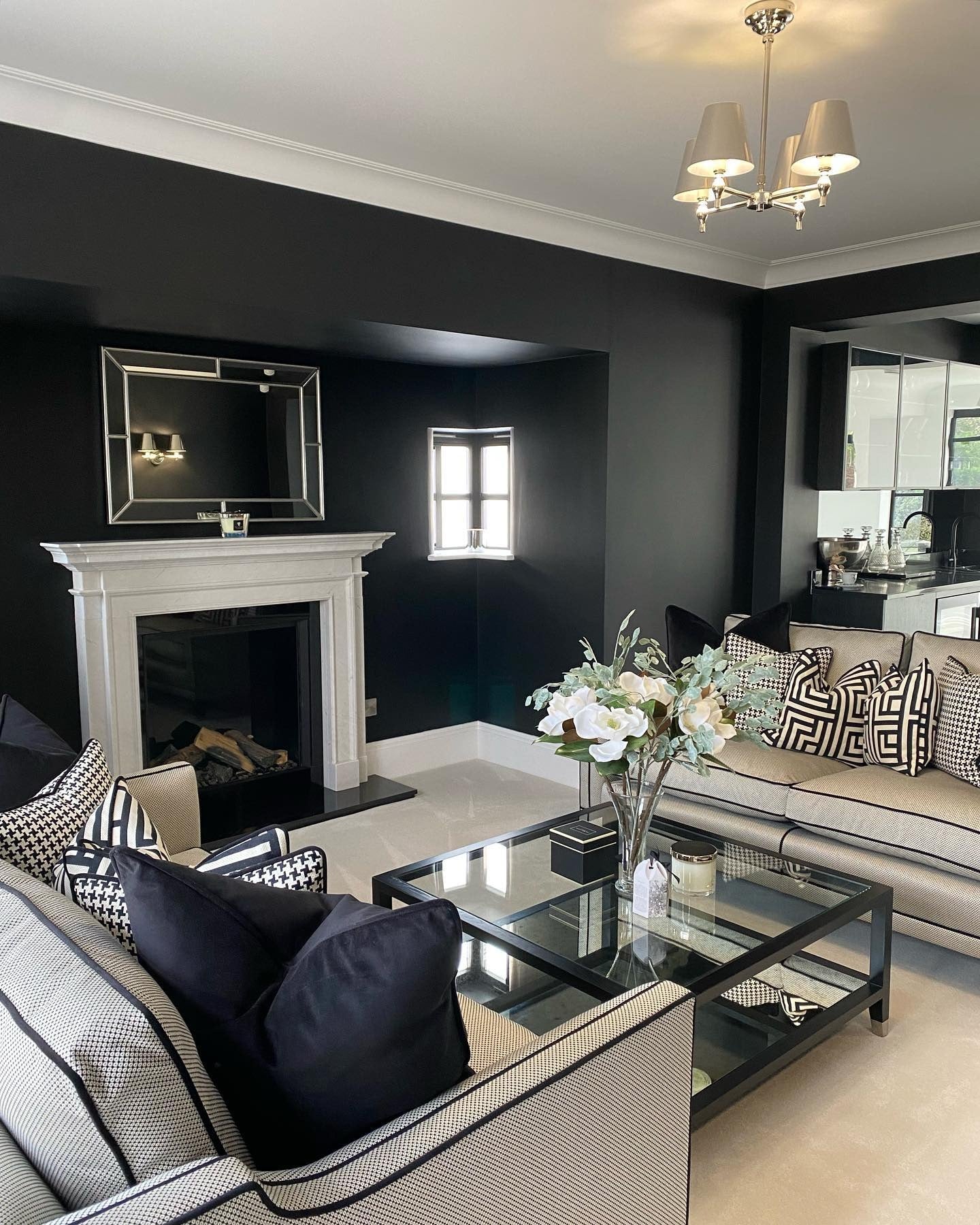 Mirrored Fireplace Frame Reflects Light and Adds Depth