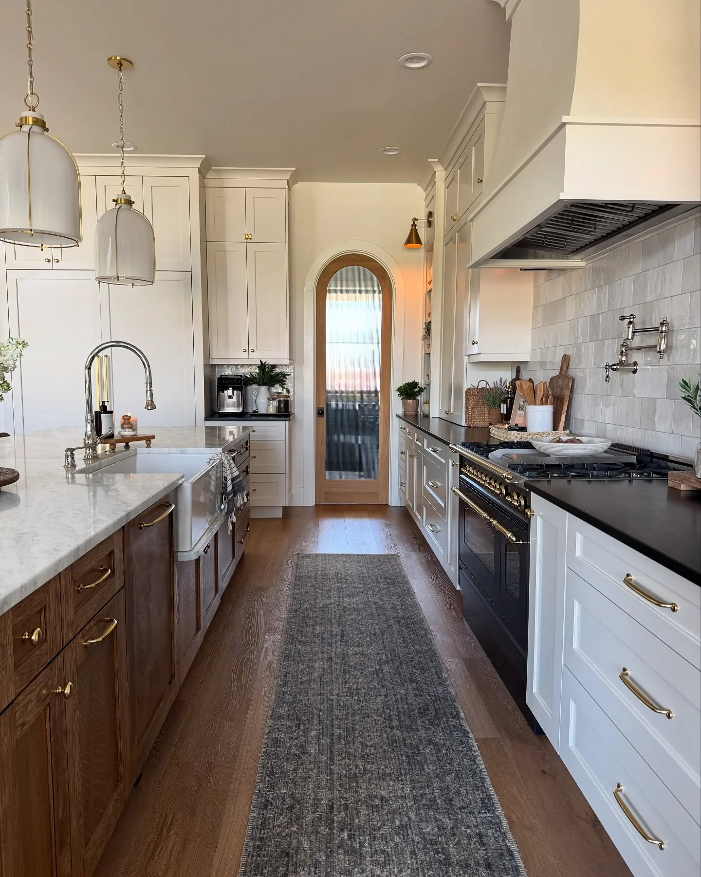 Arched Glass Door Adds Textured Transition