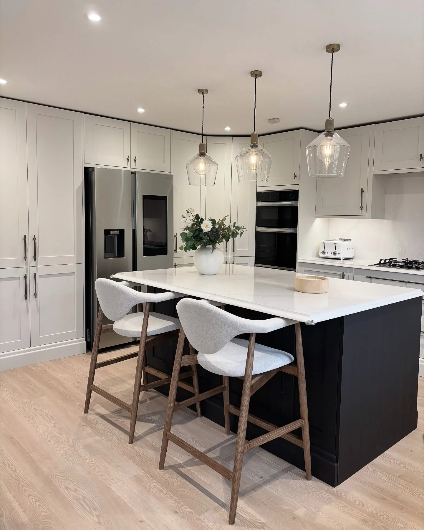 Paneled Black Island Creates a Bold Focal Point