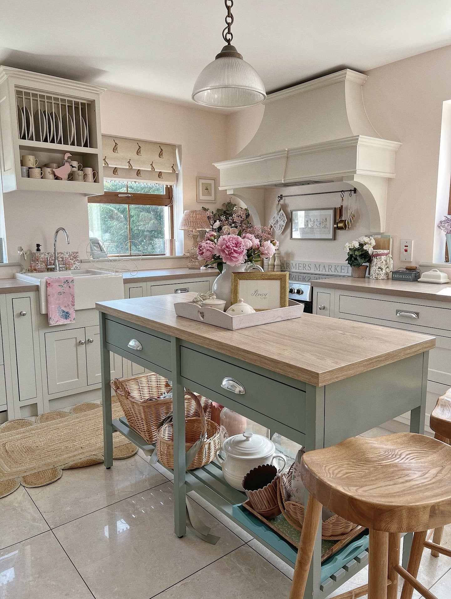 Sage Green Island with Woven Baskets on Open Shelves
