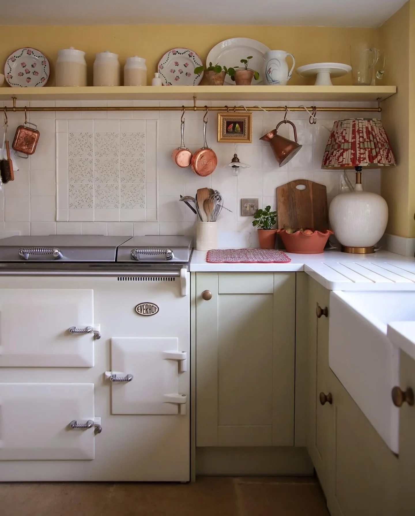 Brass Rail Holds Copper Pots and Kitchen Tools