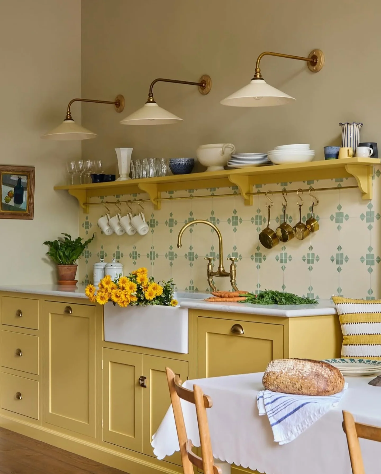 Brass Sconces Above Shelves for Focused Task Lighting