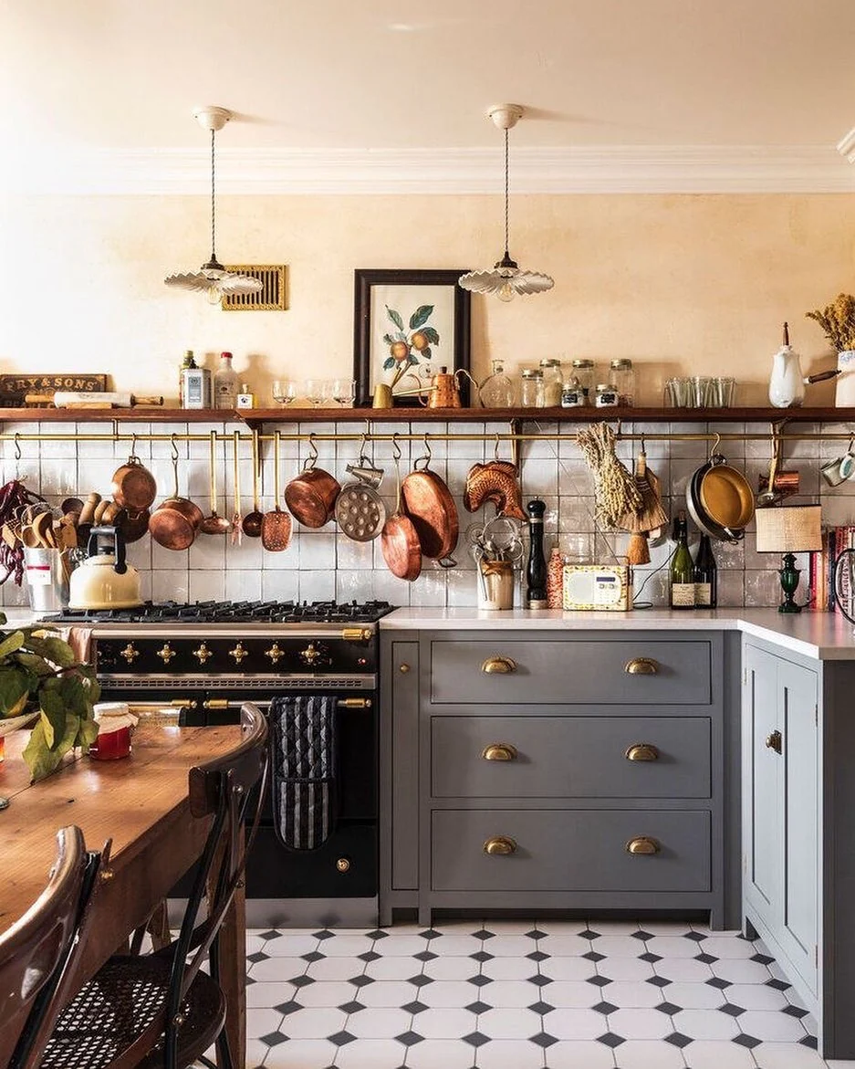Open Shelving Displays Copper Pots and Dried Herbs