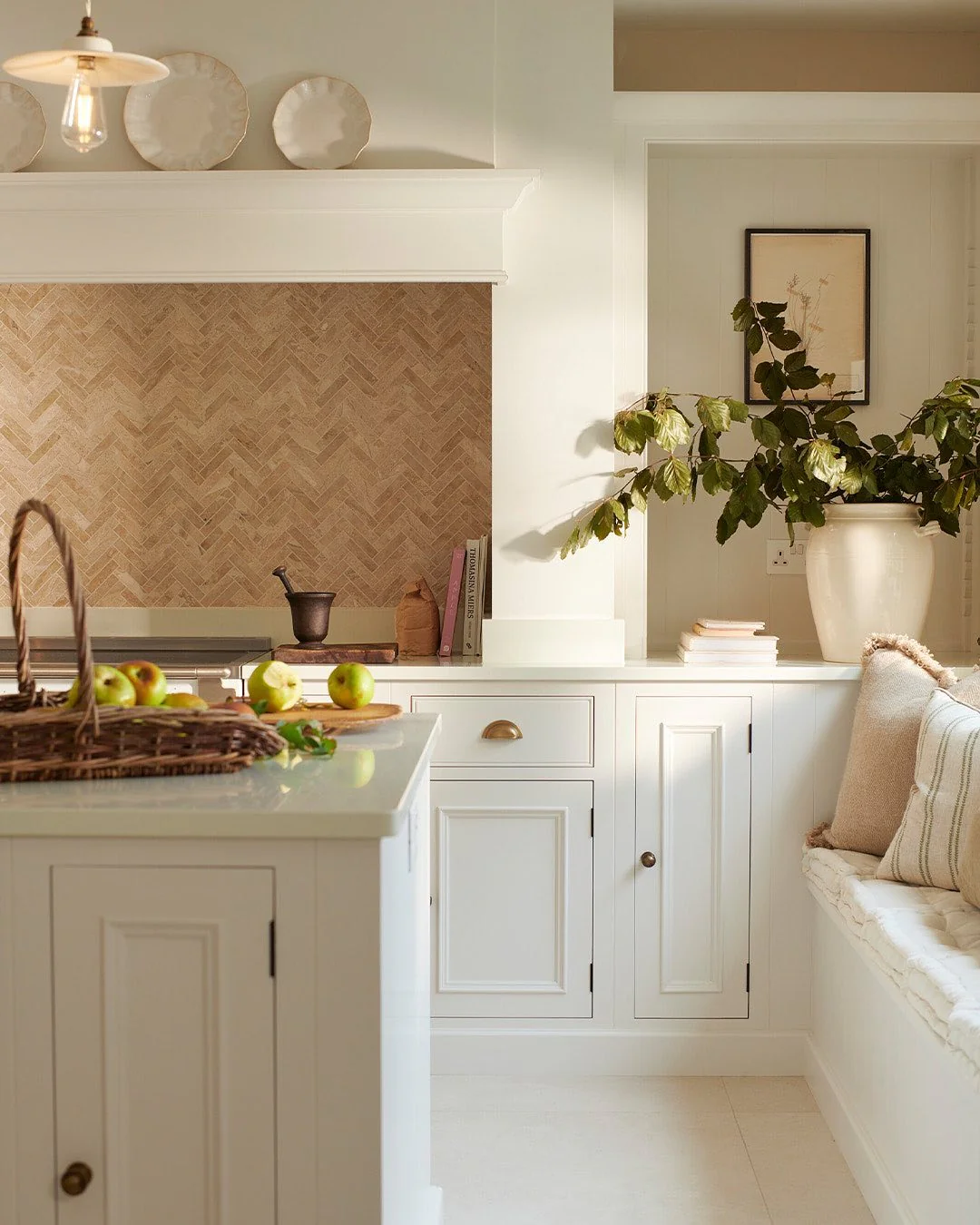 Herringbone Tile Backsplash Adds Warm Texture Behind Range
