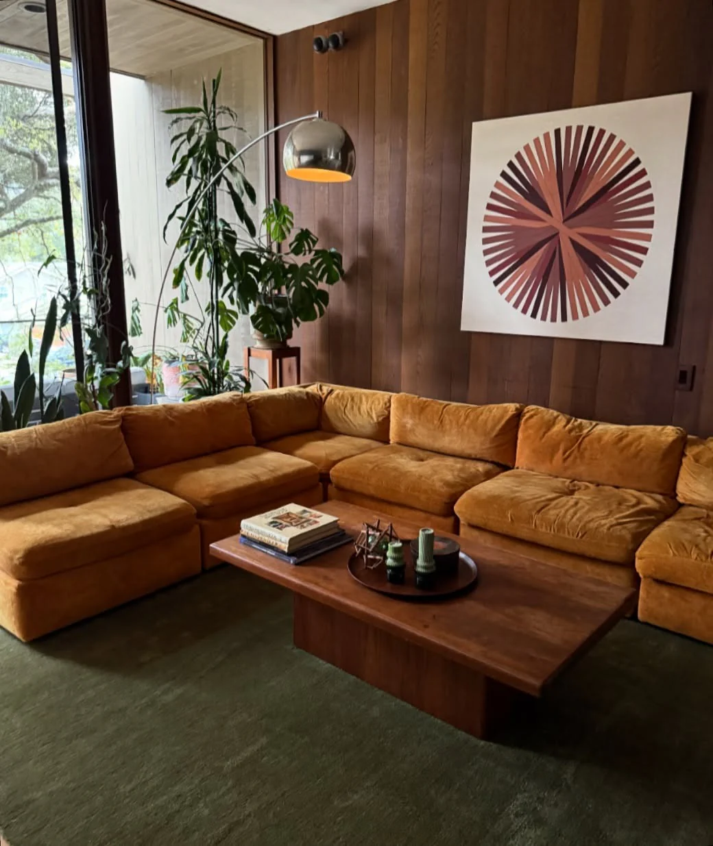 Large-Scale Geometric Art Anchors Wood-Paneled Wall
