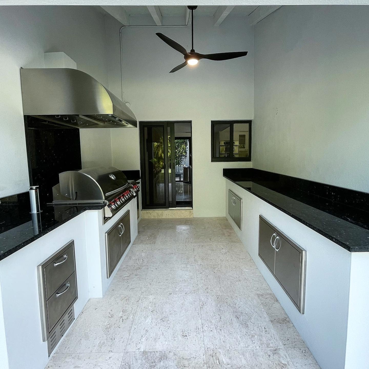 Stainless Steel Drawers and Cabinets Keep Outdoor Kitchen Tools Hidden