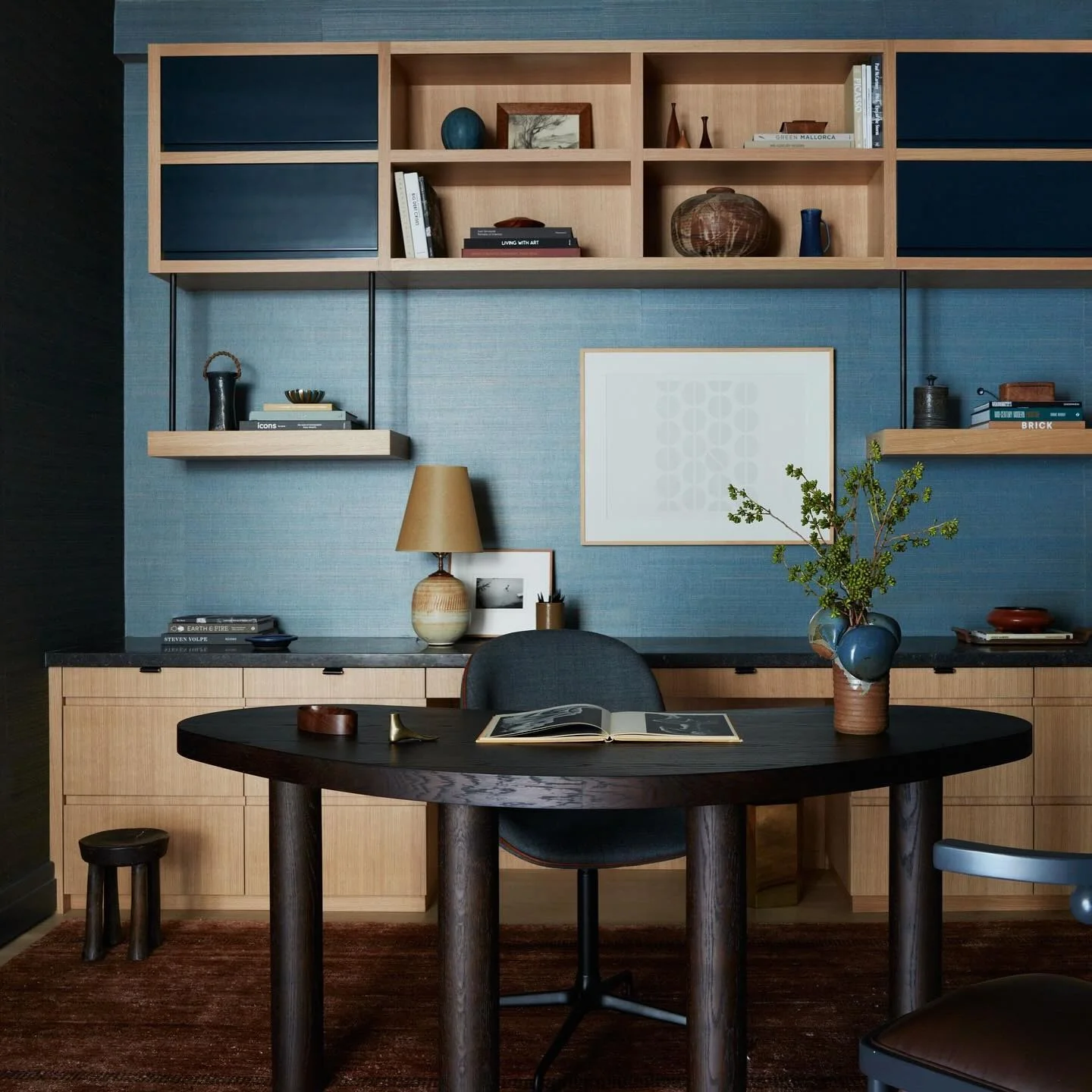 Floating Shelves Add Open Display Space Above a Desk