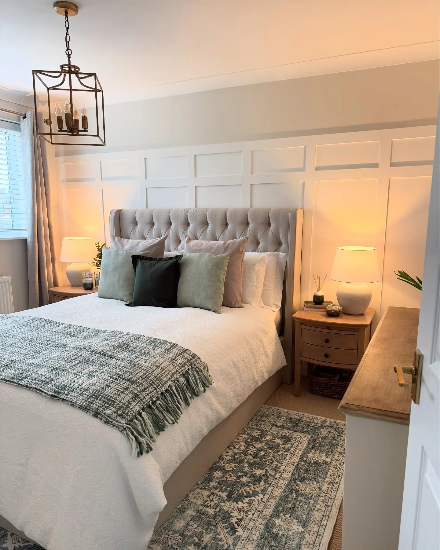 Paneled Wall Creates a Subtle, Elegant Backdrop for the Bed