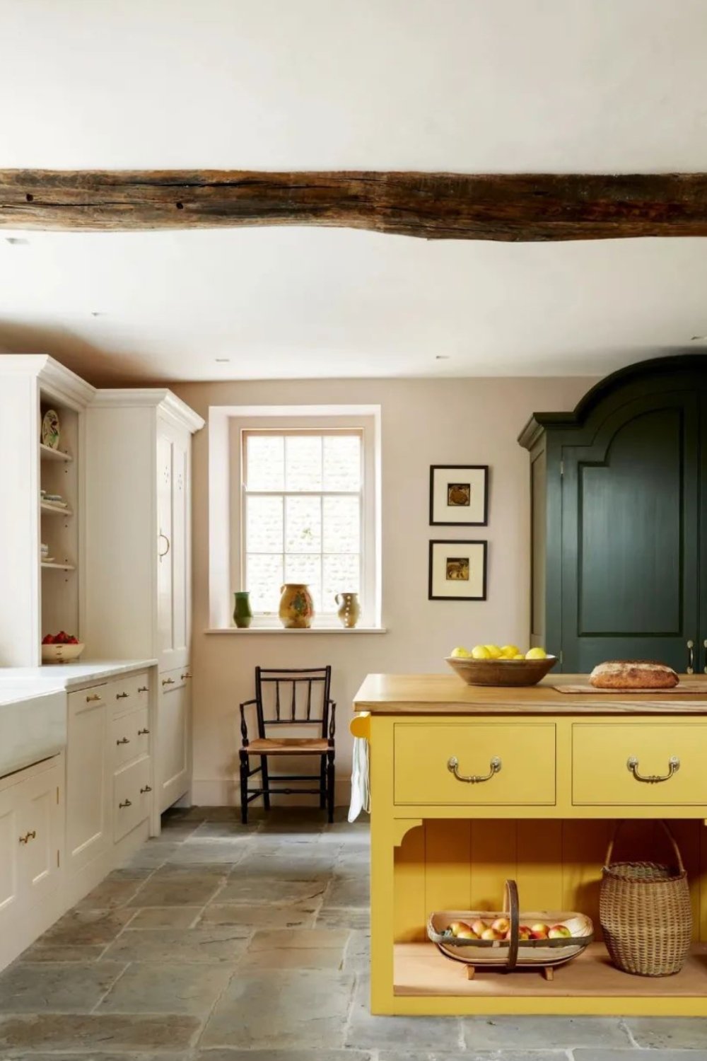 Sunny Yellow Island with Dark Green Cabinetry Creates Contrast
