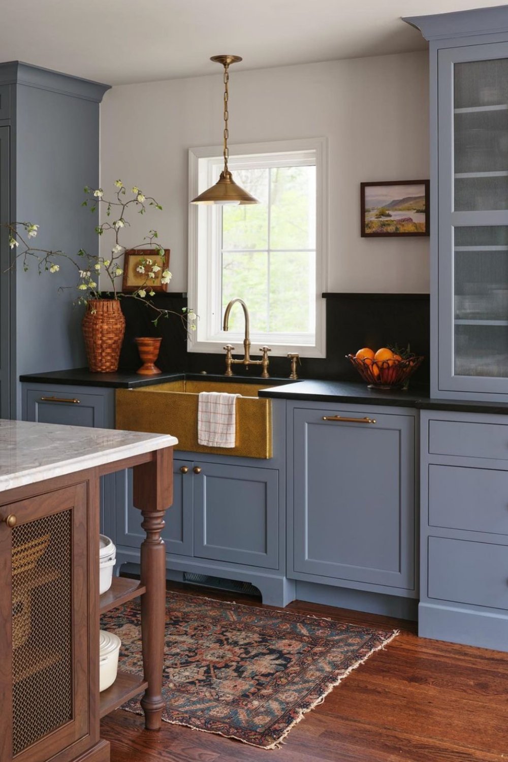 Matte Blue Cabinetry with Subtle Brass Pulls for a Polished Look