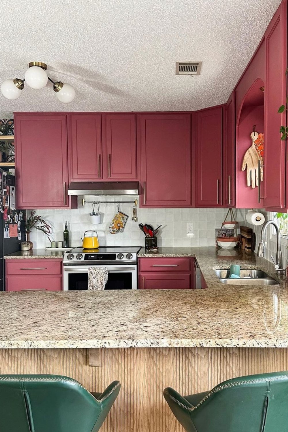 Deep Raspberry Cabinets with Minimalist Brass Bar Pulls