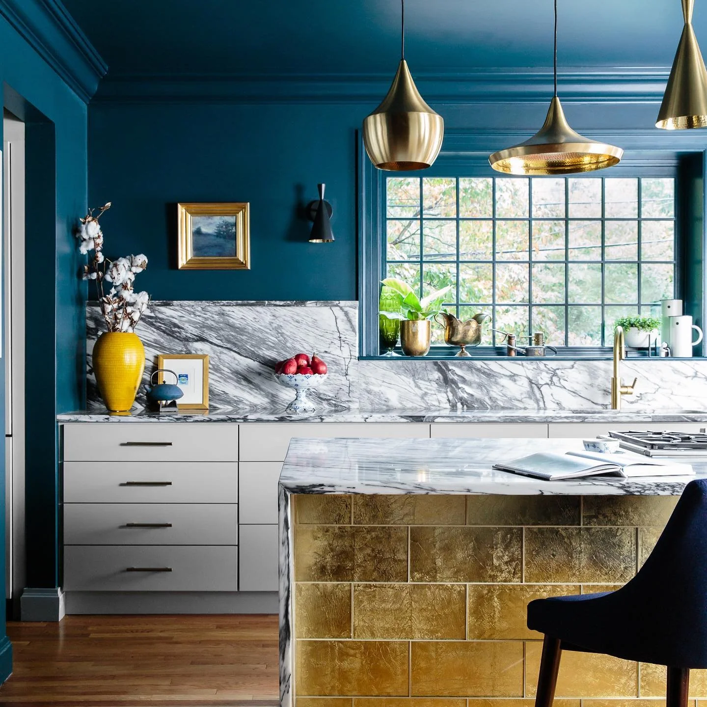 Gold Leaf Tile Island Base Adds Rich Texture to Kitchen
