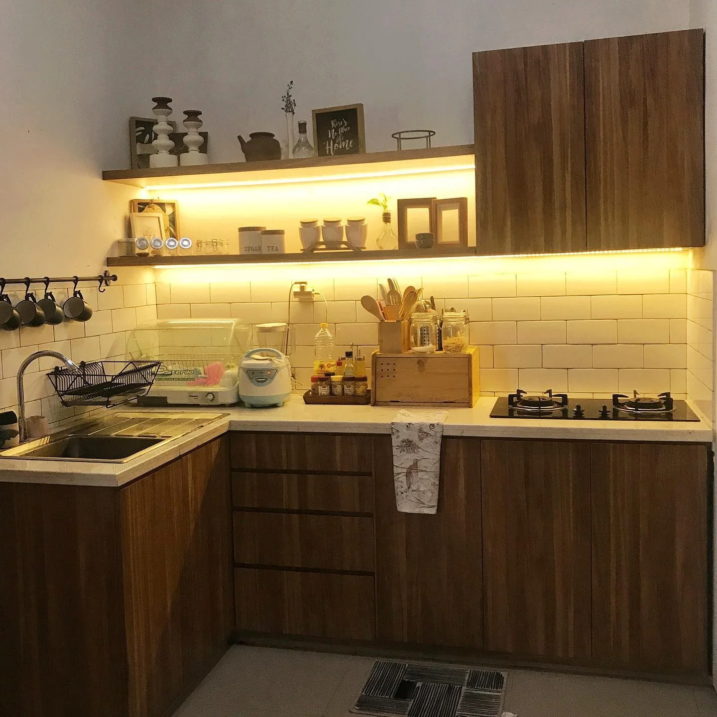 Under-cabinet lighting casts a warm, inviting glow