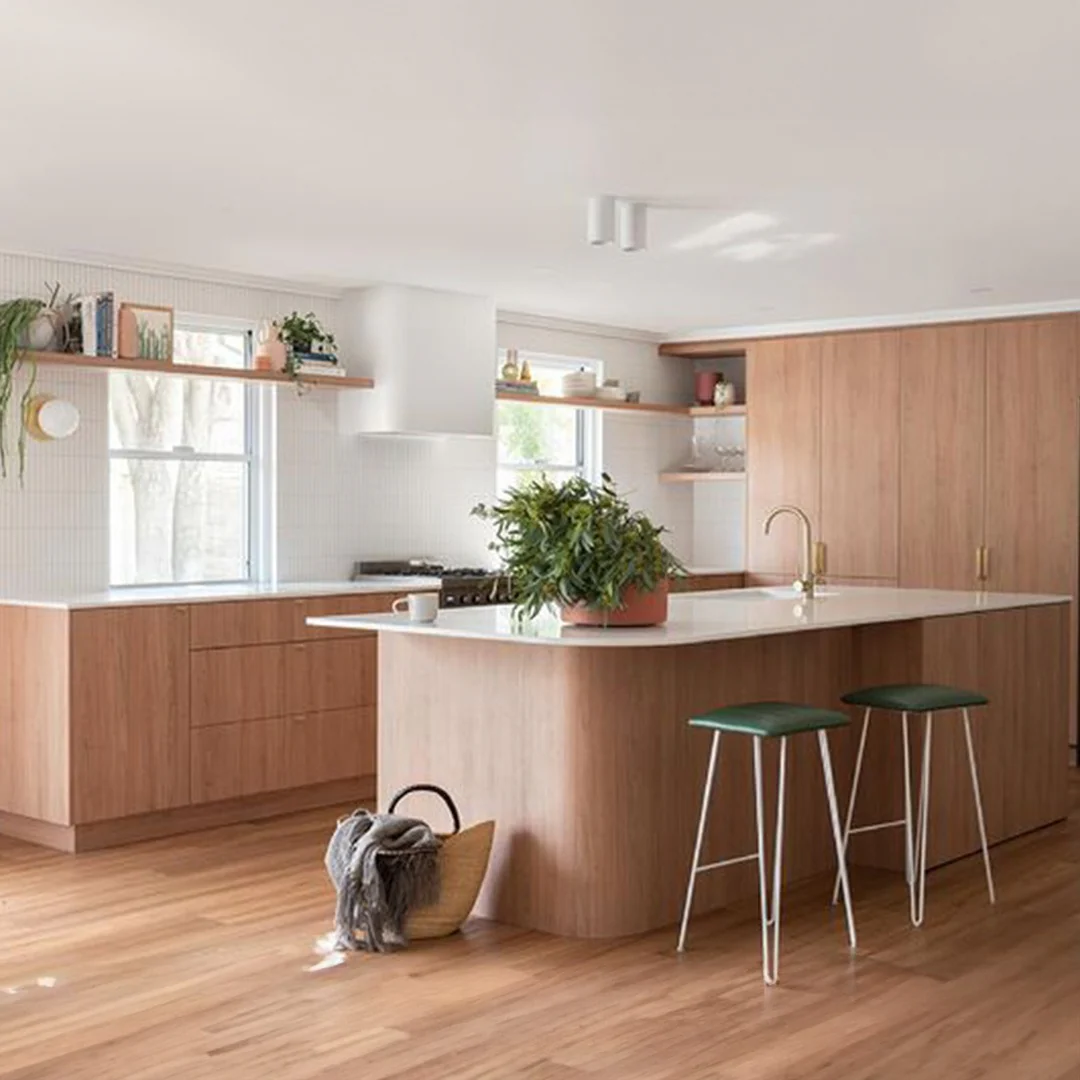 Curved Wood Island Adds Softness to Kitchen Layout