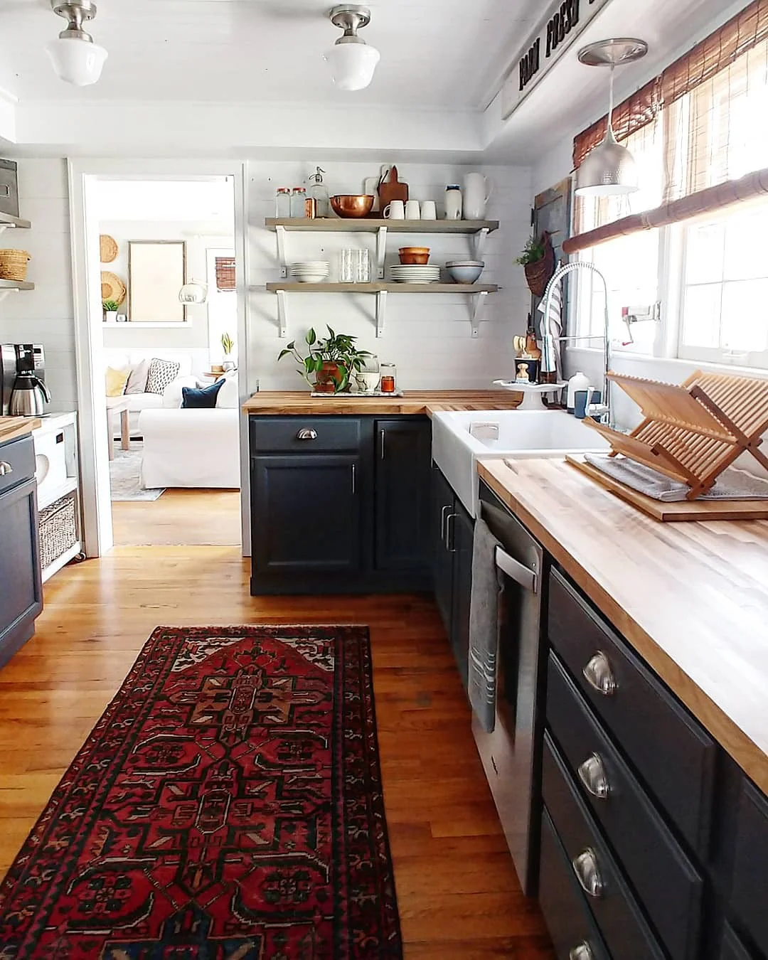 Dark Kitchen Cabinets Ground a Warm Wood Countertop