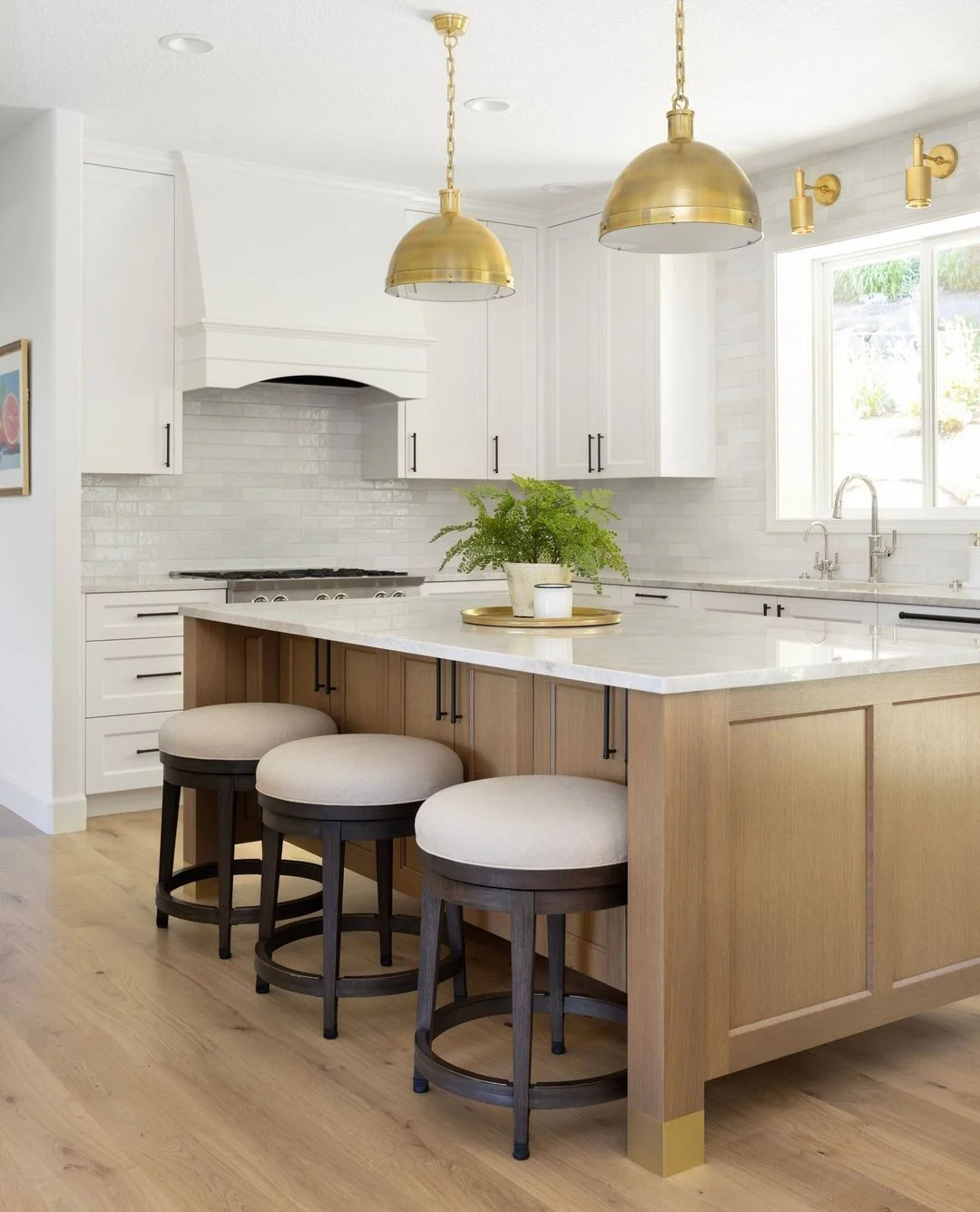 Brass Accents on Island Legs Add a Luxe Touch