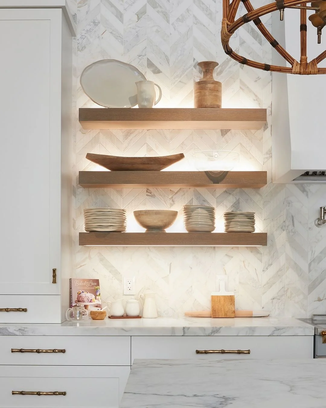 Herringbone Marble Tile Backsplash with Integrated Shelf Lighting
