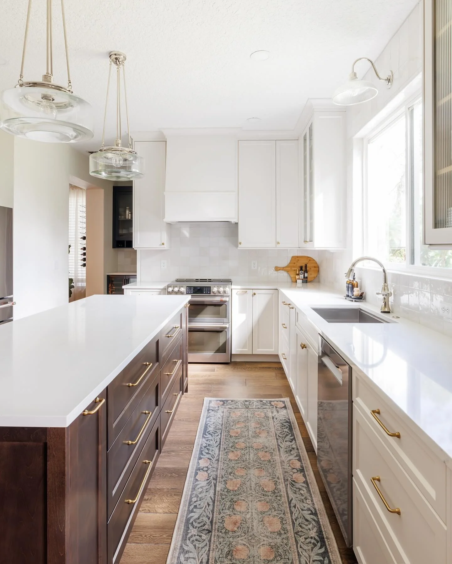 White Tile Backsplash With a Wooden Cutting Board Display